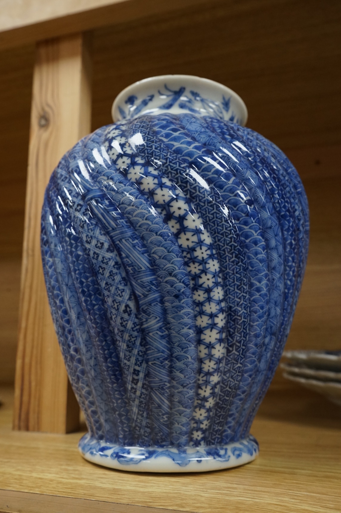 A Japanese blue and white water jar and cover, with fish knop, Meiji period, 31cm high